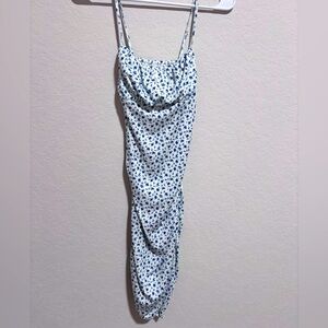 Floral slip on dress with scrunched on the sides to give a more snatched look